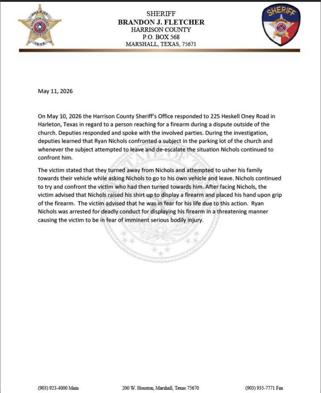 Redacted screenshot crop of a Harrison County Sheriff's Office press release dated May 11, 2026. The visible text says deputies responded to Heskell Oney Road in Harleton and that the alleged victim said Ryan Nichols raised his shirt to display a firearm and placed his hand on the grip.